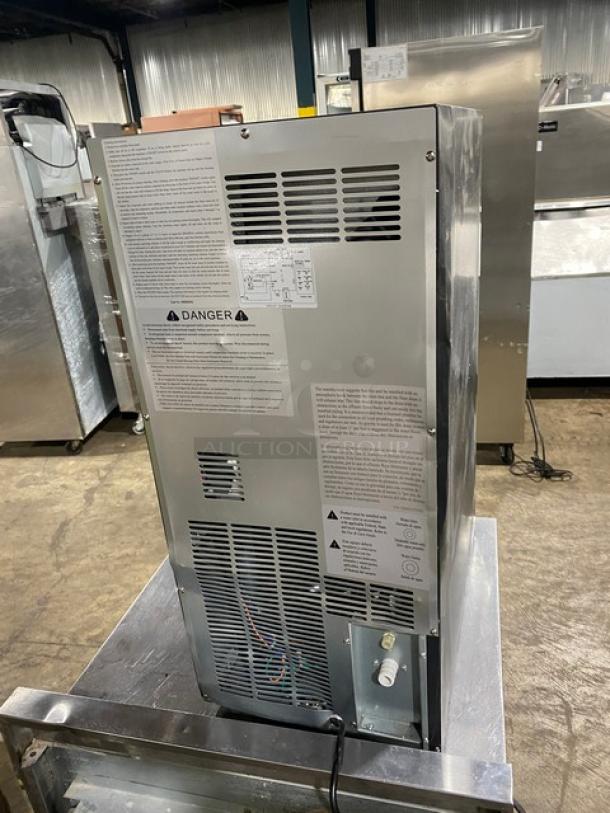 Asbury MIM50 stainless steel ice maker and bin combo, Energy Star certified, model SN: 00500420057, with visible safety labels.