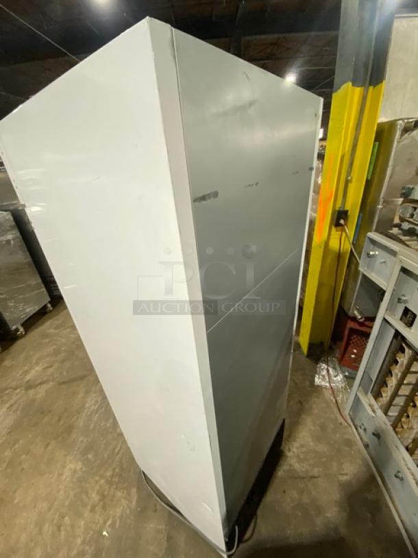 Turbo Air TGIM23WN single glass door ice merchandiser freezer, white, with poly-coated wired rack, in used condition.