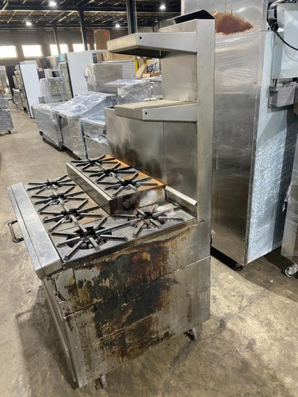 Jade Range 8-burner stainless steel commercial range with chef base, backsplash, and double back guard. Used condition.