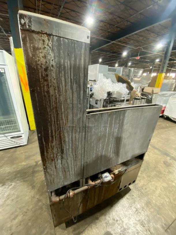 Jade Range commercial 8-burner gas range with 2-drawer chef base, back splash, and flue riser. Rust visible on surface.