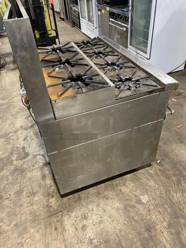 Jade Range commercial stainless steel 8-burner range on legs with 2-drawer chef base, backsplash, and double back guard. Condition: used.