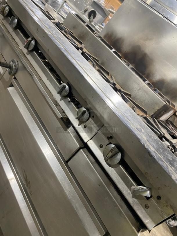 Jade Range stainless steel 8-burner range with 2-drawer chef base, backsplash, and double back guard. Natural gas, commercial use.