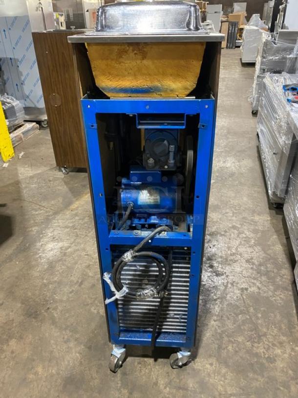 Electro Freeze single flavor soft serve machine, stainless steel, electric-powered, wooden-style finish, on casters.