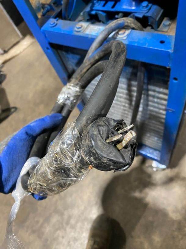 Electro Freeze soft serve machine, stainless steel, single flavor, on casters, electric powered, shown with power cord.