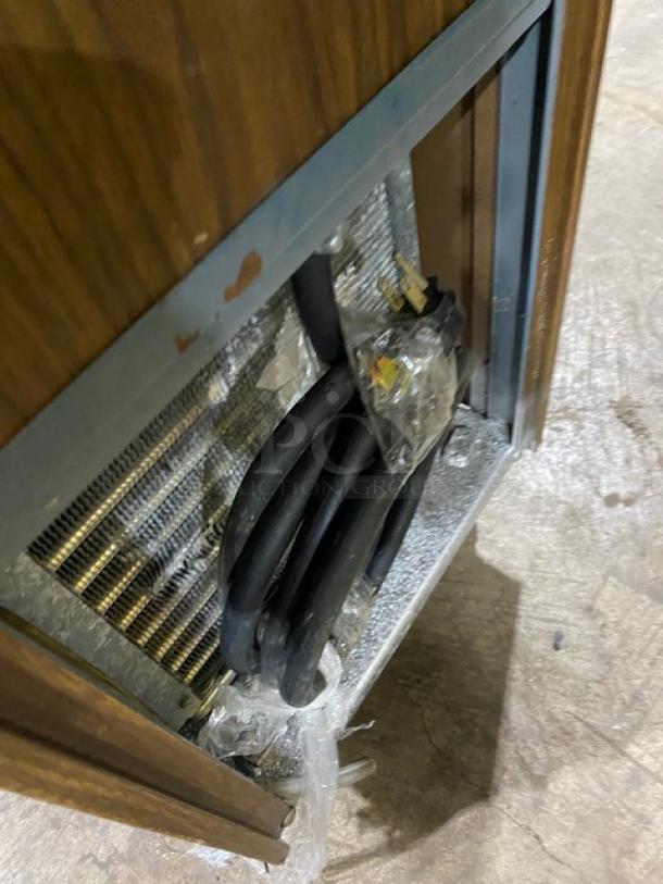 Duke Model 876 stainless steel electric slush machine, wooden-style finish, single flavor, on casters, 115V, 1 phase power.