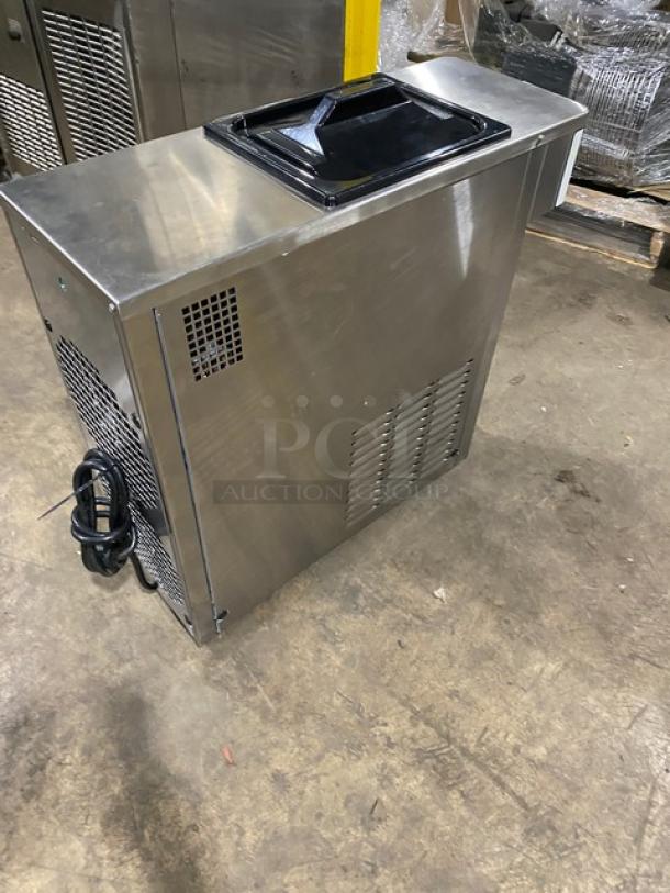 Spaceman 6210-C stainless steel countertop soft serve machine, gravity-fed, electric, on legs, visible cords.