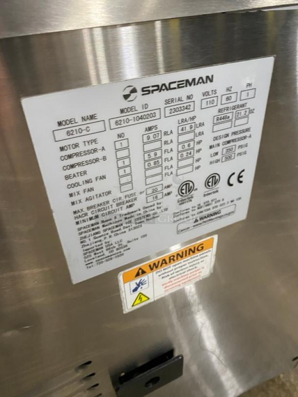 Spaceman 6210C soft serve machine, stainless steel, countertop model, single flavor, 110V, serial 2303342, on legs.