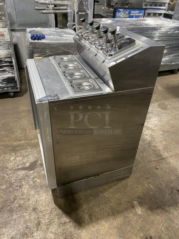 Silver King SKF2A stainless steel ice cream topping dispenser, single door, with poly coated rack, excellent condition.
