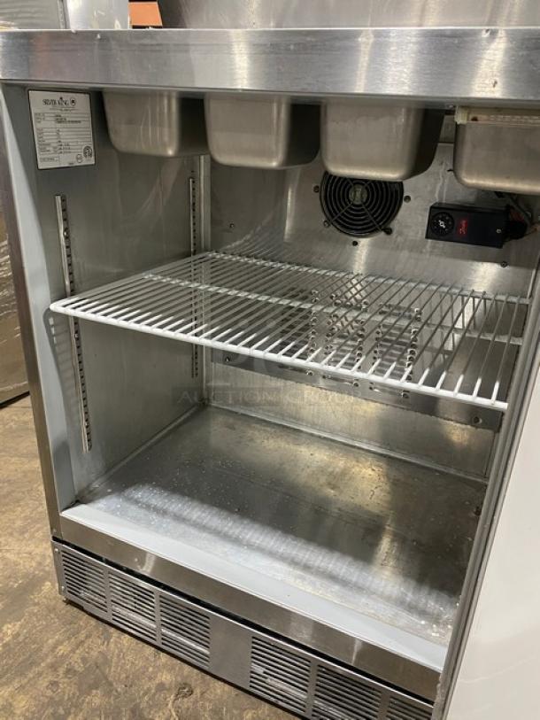 Silver King stainless steel ice cream topping dispenser, model SKF2A, with poly-coated wired rack, single door, 115V.