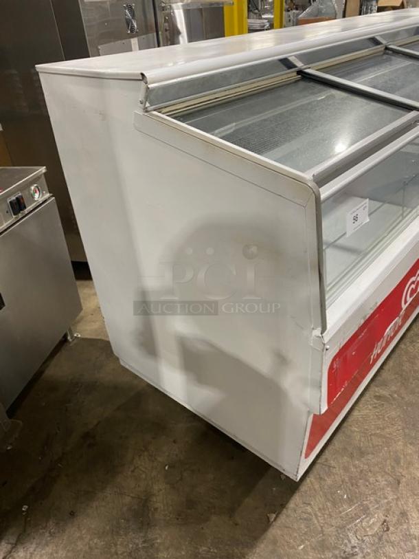 Hussmann Commercial White Low-Temp Ice Cream Display Freezer, Model LBN-8, with 4 Glass Sliding Doors, 115V, visible wear.