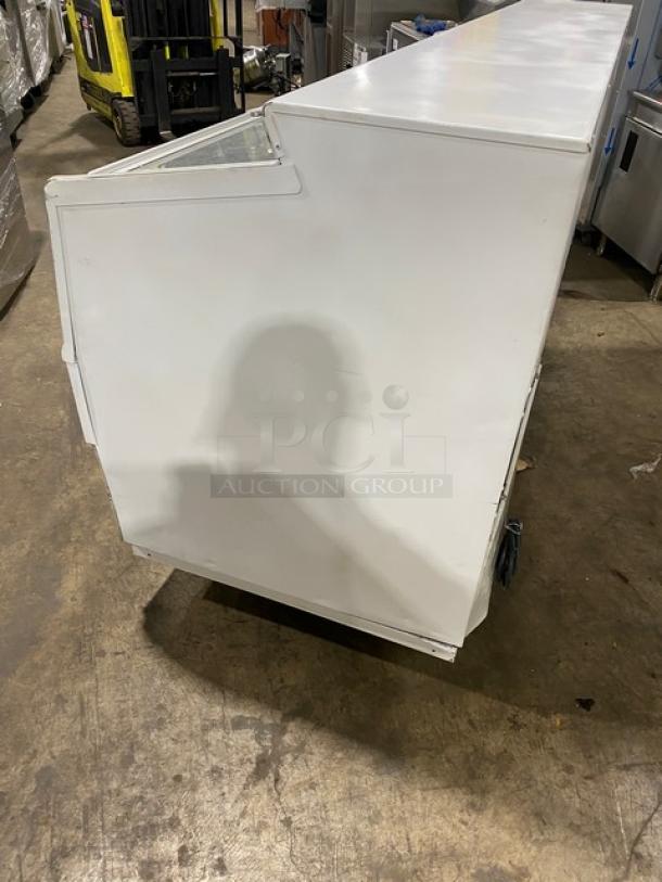 Hussmann LBN8 commercial display freezer, white, low-temperature, with 4 glass sliding doors, SN: MY11B004683, 115V, 1 phase.
