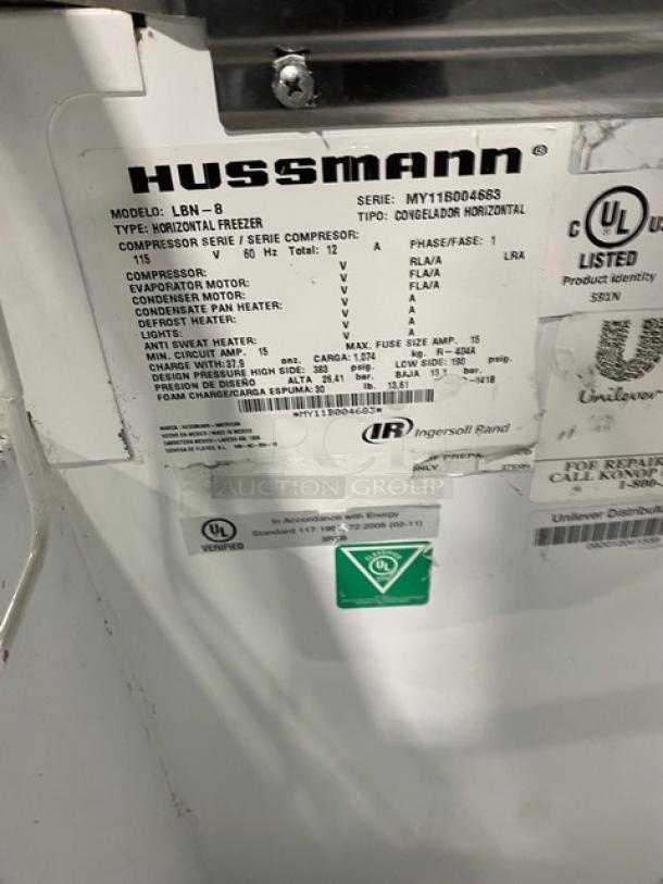 Hussmann LBN-8 commercial freezer label showing model, serial number MY11B004683, specs for 115V 1 phase operation.