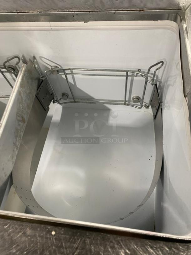 Beverage-Air BRT-68P dipping cabinet interior, white, includes partition for ice cream storage, model visible, good condition.