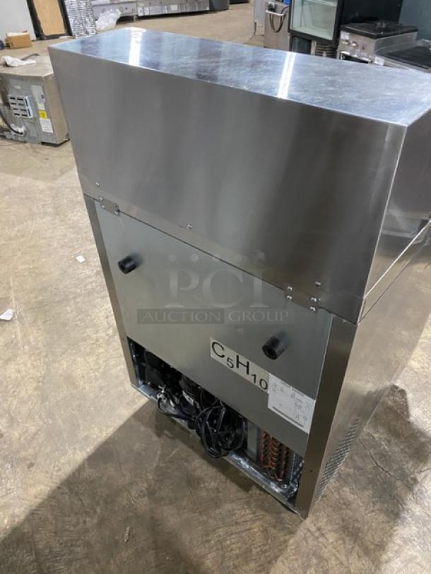 Atosa MSF8305GR single-door stainless steel refrigerated prep table, Bian Marie style, on casters, with poly-coated rack.