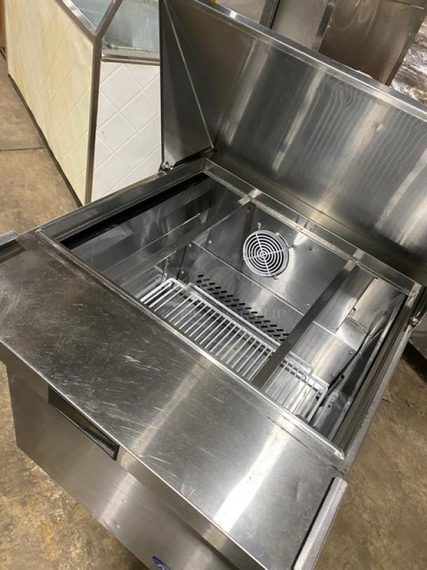 Atosa commercial stainless steel refrigerated prep table MSF8305GR, with poly-coated wired rack, on casters, in excellent condition.