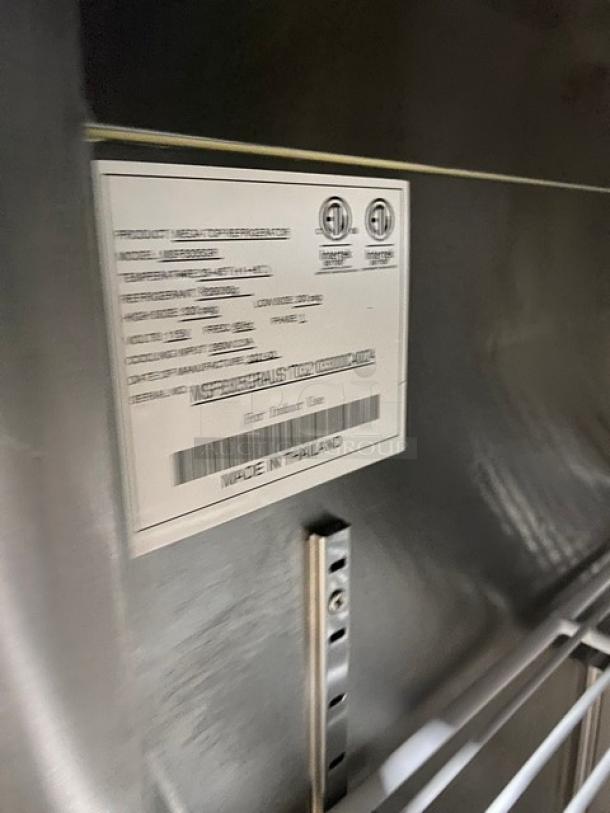 Atosa stainless steel refrigerated prep table, model MSF8305GR, with poly coated wire rack and caster wheels.