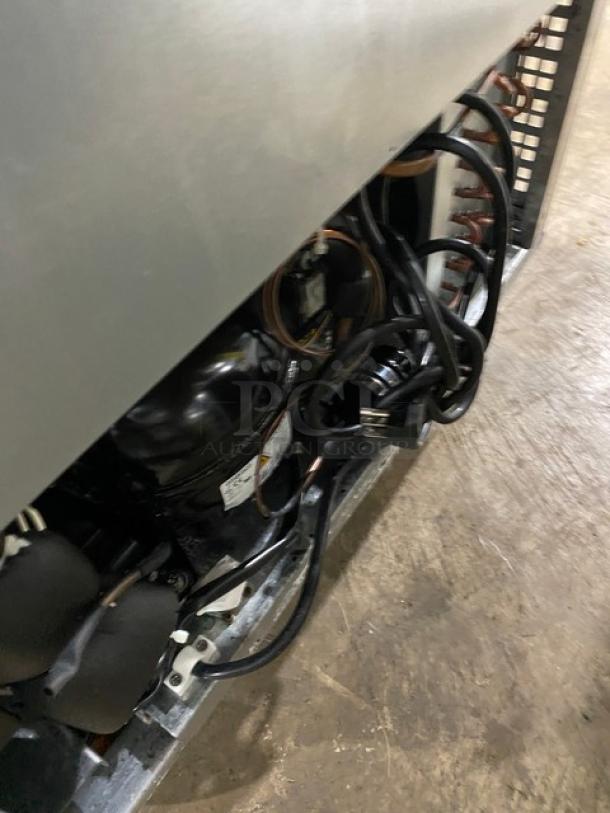 Atosa MSF8305GR stainless steel refrigerated prep table, single door, Bian Marie style, with poly-coated rack, 115V, on casters.