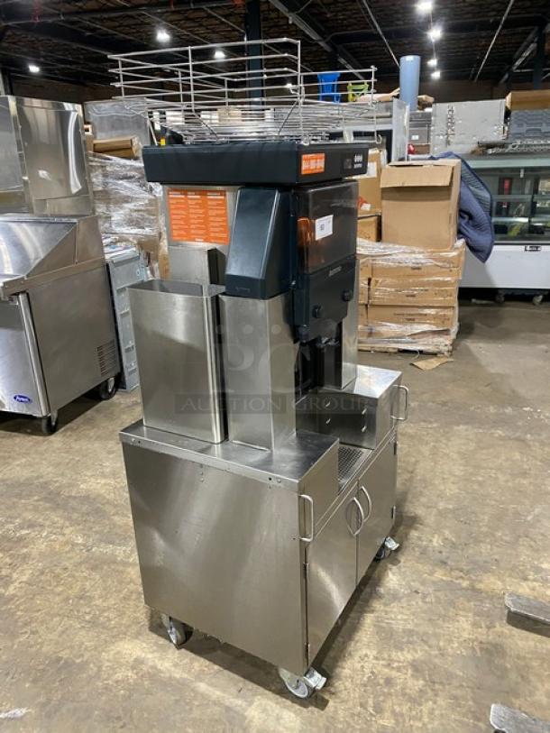 Zummo Z40CN commercial juicer, stainless steel, on casters, with drip tray and dual cabinet. Model: Z40C-N, SN: 02227252AG.