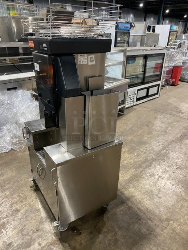 Zummo Z40CN commercial stainless steel orange and citrus juicer on casters, featuring a drip tray and dual cabinet combo.