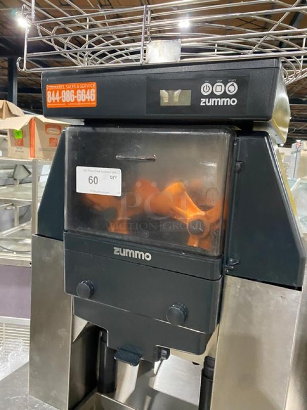 Zummo Z40CN citrus juicer, stainless steel, electric, countertop model with dual cabinet and drip tray, on casters.