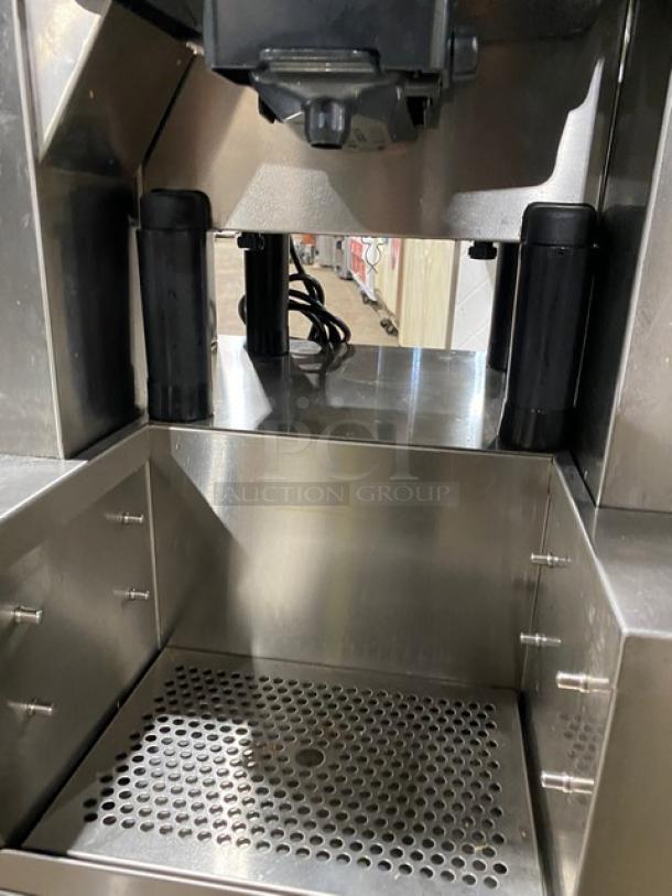 Zummo Z40CN commercial stainless steel juicer, heavy-duty, electric-powered, with drip tray and casters, model 02227252AG.