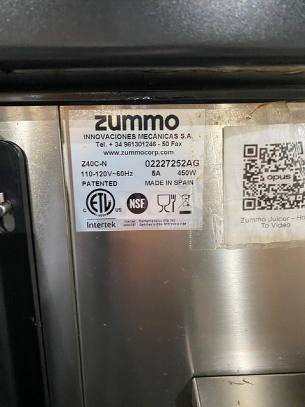 Zummo Z40C-N orange juicer, stainless steel, model SN: 02227252AG, 110-120V, on casters, includes drip tray, made in Spain.