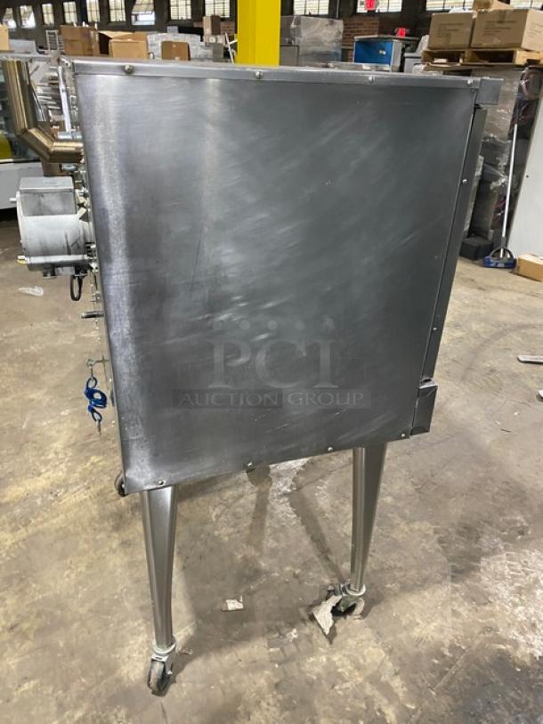 Imperial commercial stainless steel natural gas convection oven with wired rack, single stack, on casters, used condition.