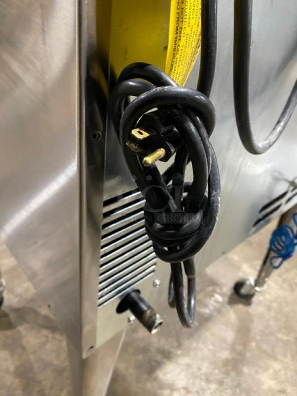 Imperial commercial stainless steel natural gas convection oven on casters, with wired rack. Features power cord and vent.