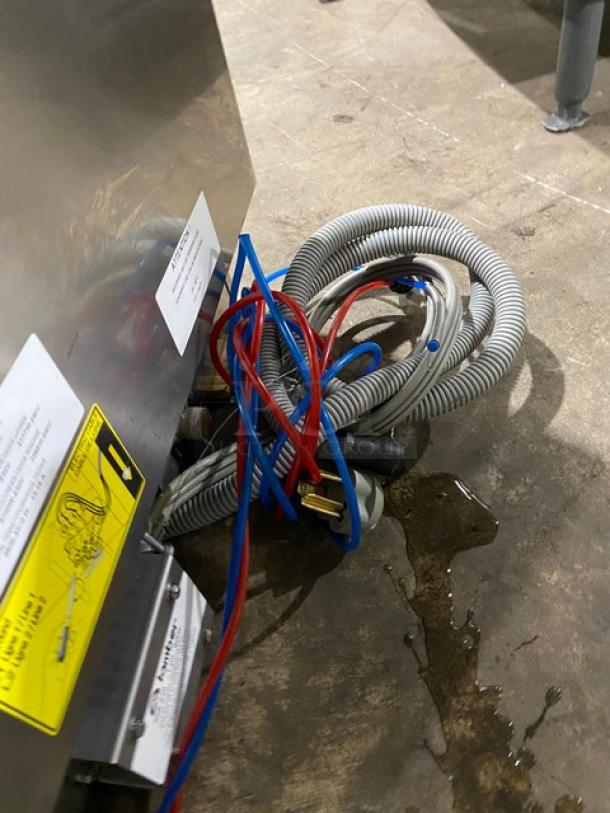 Lamber DSP4PS stainless steel undercounter dishwasher with visible tags and hoses. High-temp, electric 208-240V, late model.