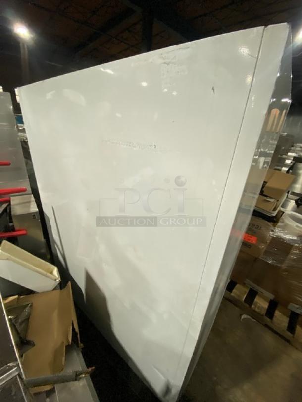 Beverage-Air MT45 commercial refrigerator; white exterior, double glass sliding doors, SN: 5263195, with poly-coated rack, 115V.