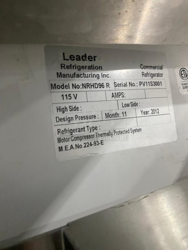 Leader NRHD96 commercial stainless steel refrigerated display case with curved glass, rear sliding doors, and storage.