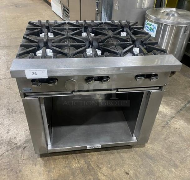 U.S. Range commercial stainless steel 6 burner natural gas range with enclosed dry cabinet base, on casters, in good condition.