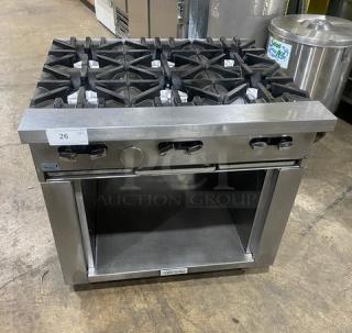 U.S. Range commercial stainless steel 6 burner natural gas range with enclosed dry cabinet base, on casters, in good condition.