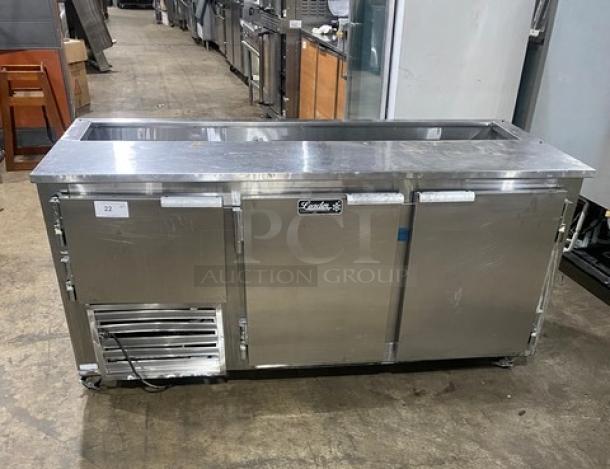 Leader Commercial 3-door stainless steel refrigerated prep table on casters with poly-coated rack; 115V 1 Phase, lightly used.