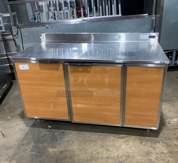 Duke RBC60M commercial refrigerator, wooden style stainless steel, 2 doors, upturned backsplash, on legs, model SN: 09135680.