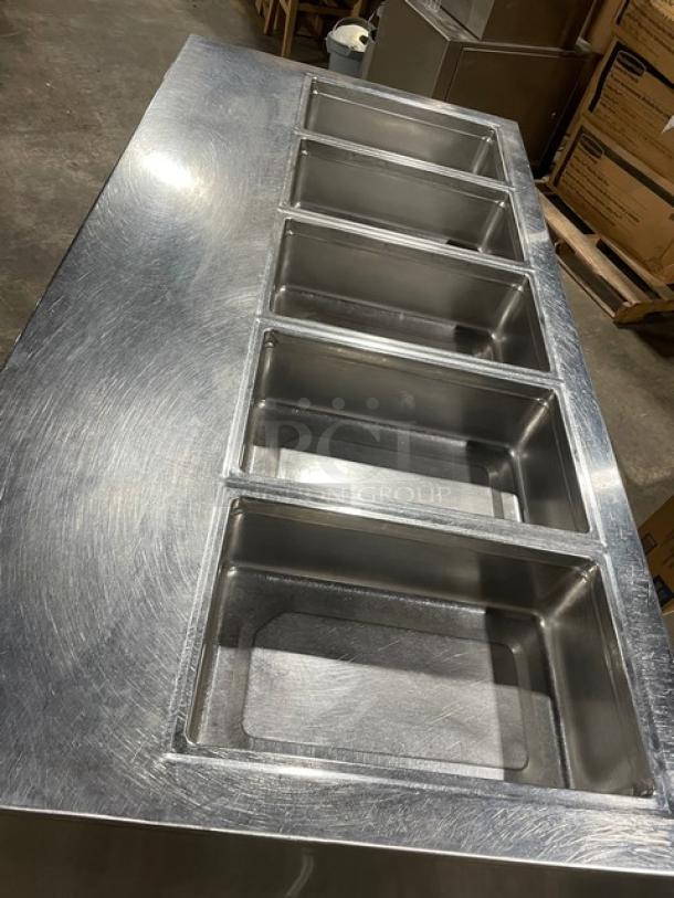 Delfield 18MC68P-EF stainless steel 5-well cold food/salad bar with 4 refrigerated drawers and enclosed undershelf, on casters.