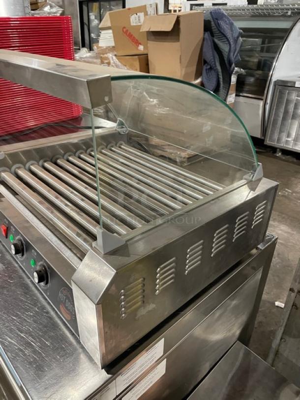 Festival ET-R2-11 stainless steel electric hot dog roller with curved sneeze guard, excellent condition, 110V.
