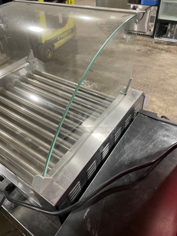 Festival ET-R211 stainless steel hot dog roller with curved sneeze guard, electric-powered, 110V, SN: 2300361.