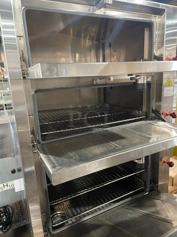 Flame-Mate ESC3NN commercial stainless steel steam cabinet, 3 compartments, natural gas, 1 phase, on legs, excellent condition.