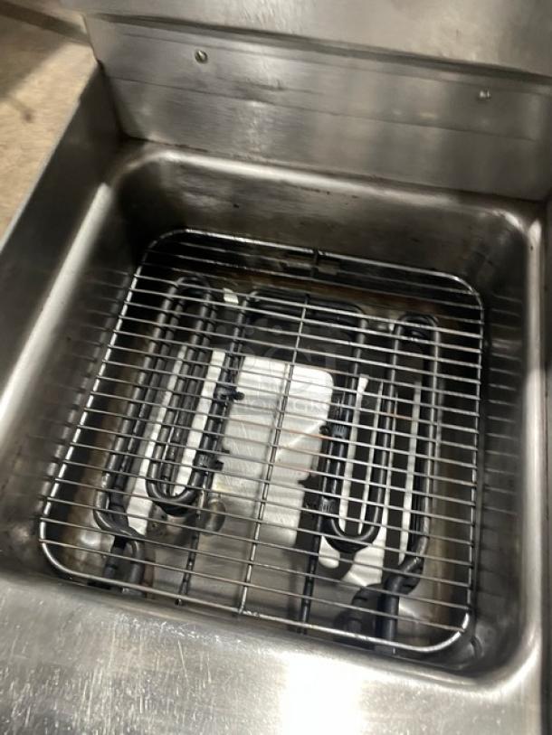Keating 14CMBB stainless steel electric fryer with backsplash, basket hanger, thermostatic control, 208-240V 3-phase.