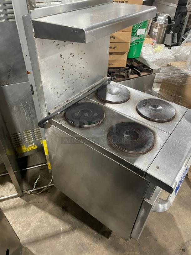 Imperial Commercial Stainless Steel 4 Burner Hot Plate Range/Oven Combo with backsplash, overhead salamander shelf, and wire oven rack.
