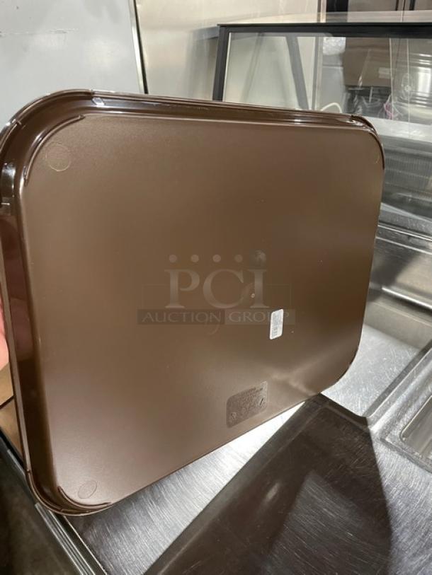 Brown Cambro 1418FF167 14"x18" tray; commercial grade, new condition, rectangular, durable surface.