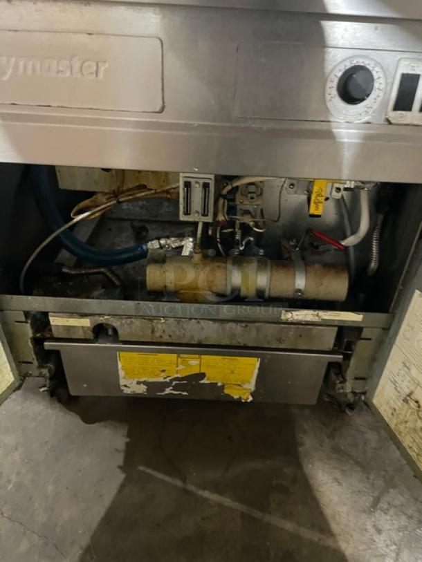 Fry Master FMP145ESC commercial stainless steel 2-bay fryer, natural gas powered, on casters, with backsplash and basket hanger.