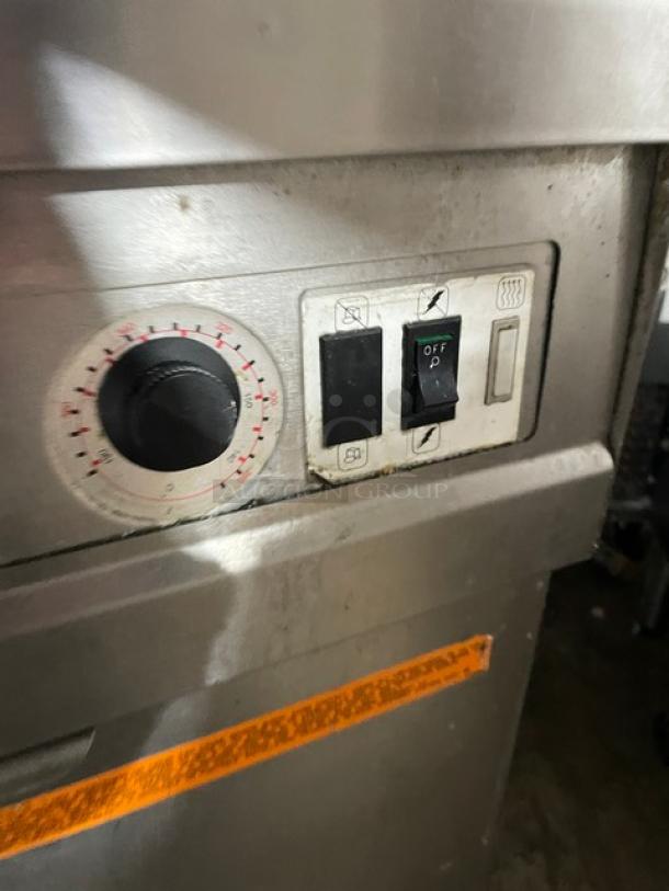 Fry Master FMP145ESC control panel with dial and switch. Stainless steel finish. Part of dual-bay fryer system.