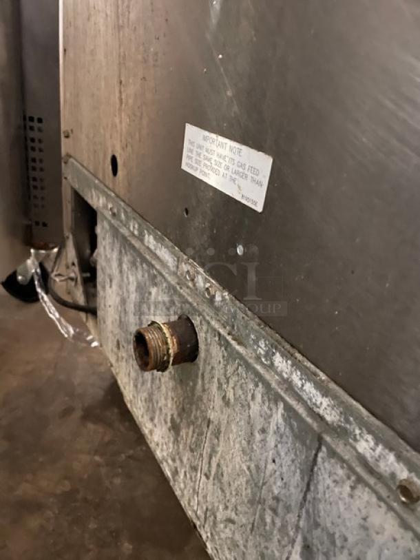 Fry Master commercial stainless steel natural gas 2-bay deep fryer, model FMP145ESC. Includes backsplash, basket hanger, on casters, SN: 1103GH0007.