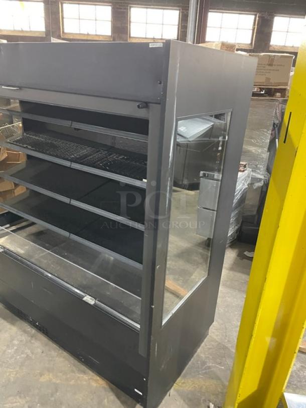 Federal Industries black multi-tier refrigerated open merchandiser, Model RSSM678SC-5, with pull-down night curtain.