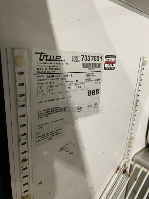 True TSSU-48-18M-B commercial stainless steel 2-door refrigerated prep table label. SN: 7037531, 115V, on casters.