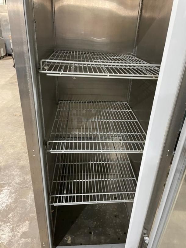 Beverage-Air HFPS1-1G stainless steel merchandiser freezer with glass door, poly-coated wire racks, on legs, good condition.