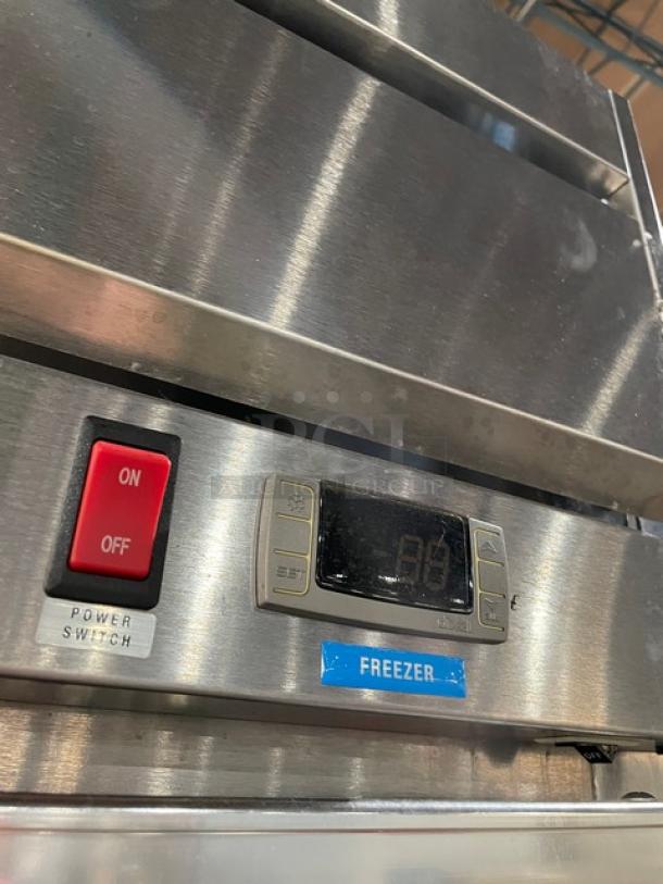 Beverage-Air stainless steel single glass door freezer, model HFPS11G, featuring digital controls and power switch.