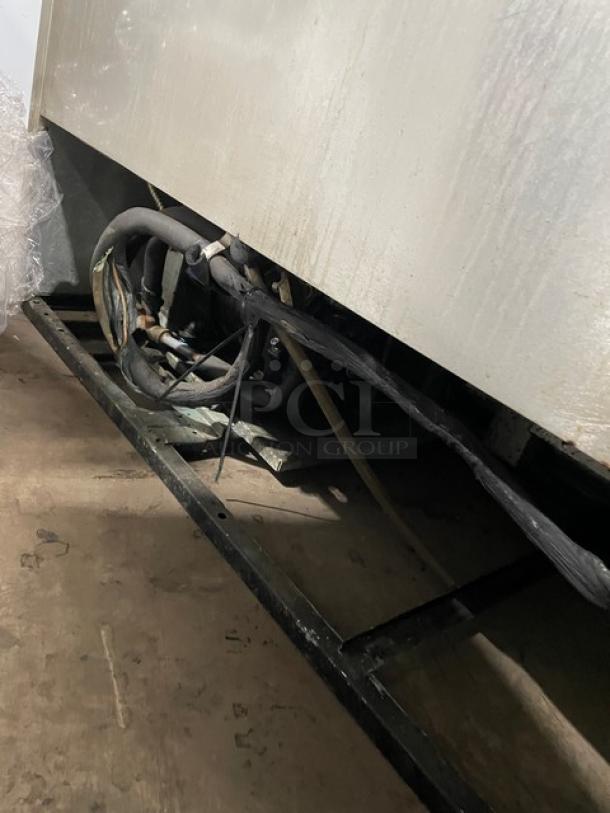 True T-49F commercial stainless steel freezer underside, 2-door, poly-coated rack, model SN: 1-3721907, 115V, 1-phase.